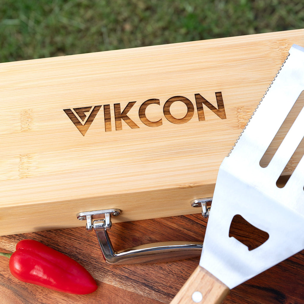 Premium stainless steel BBQ utensils in engraved bamboo case for client giftin