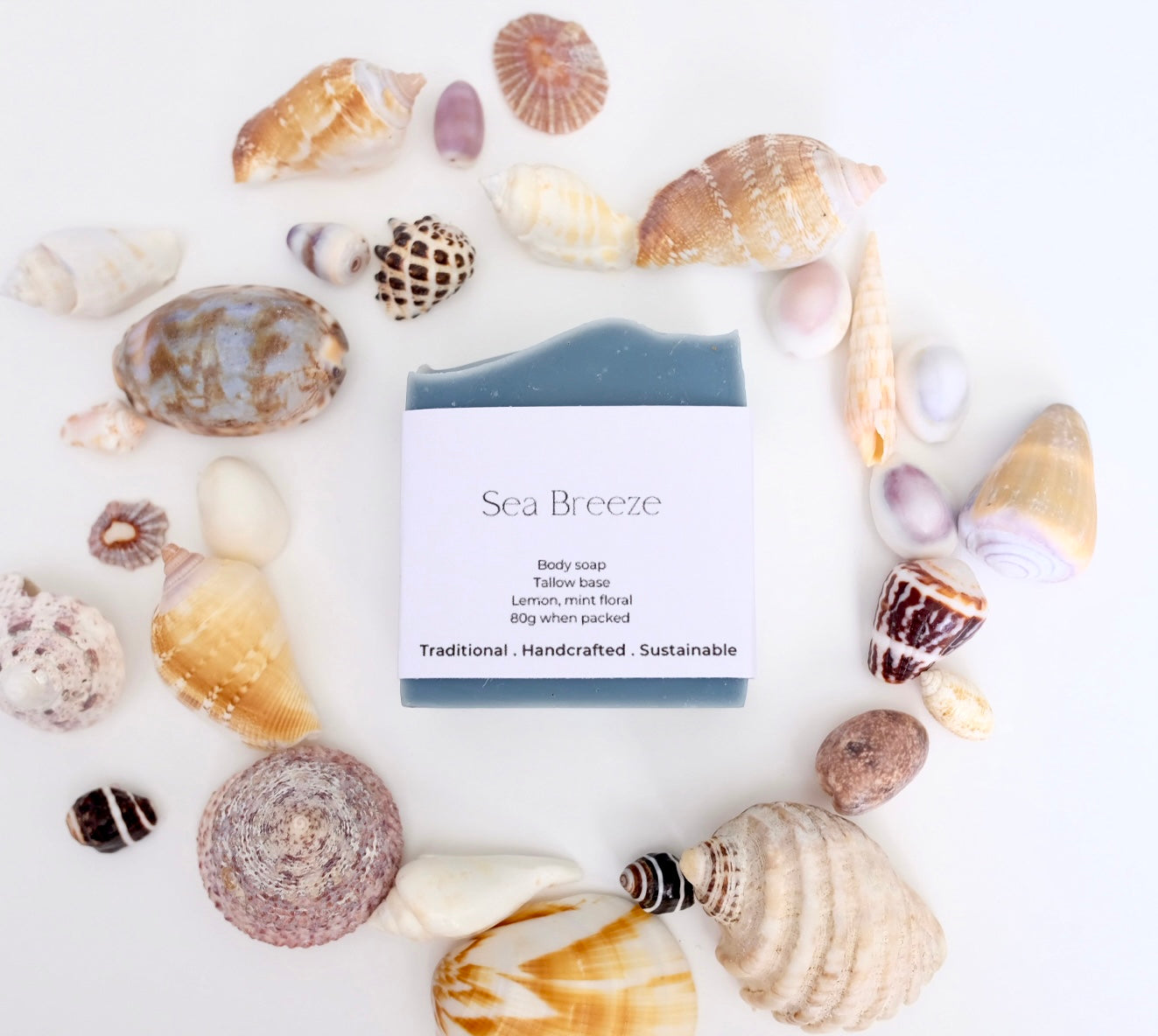 Blue body natural tallow soap surrounded by sea shells