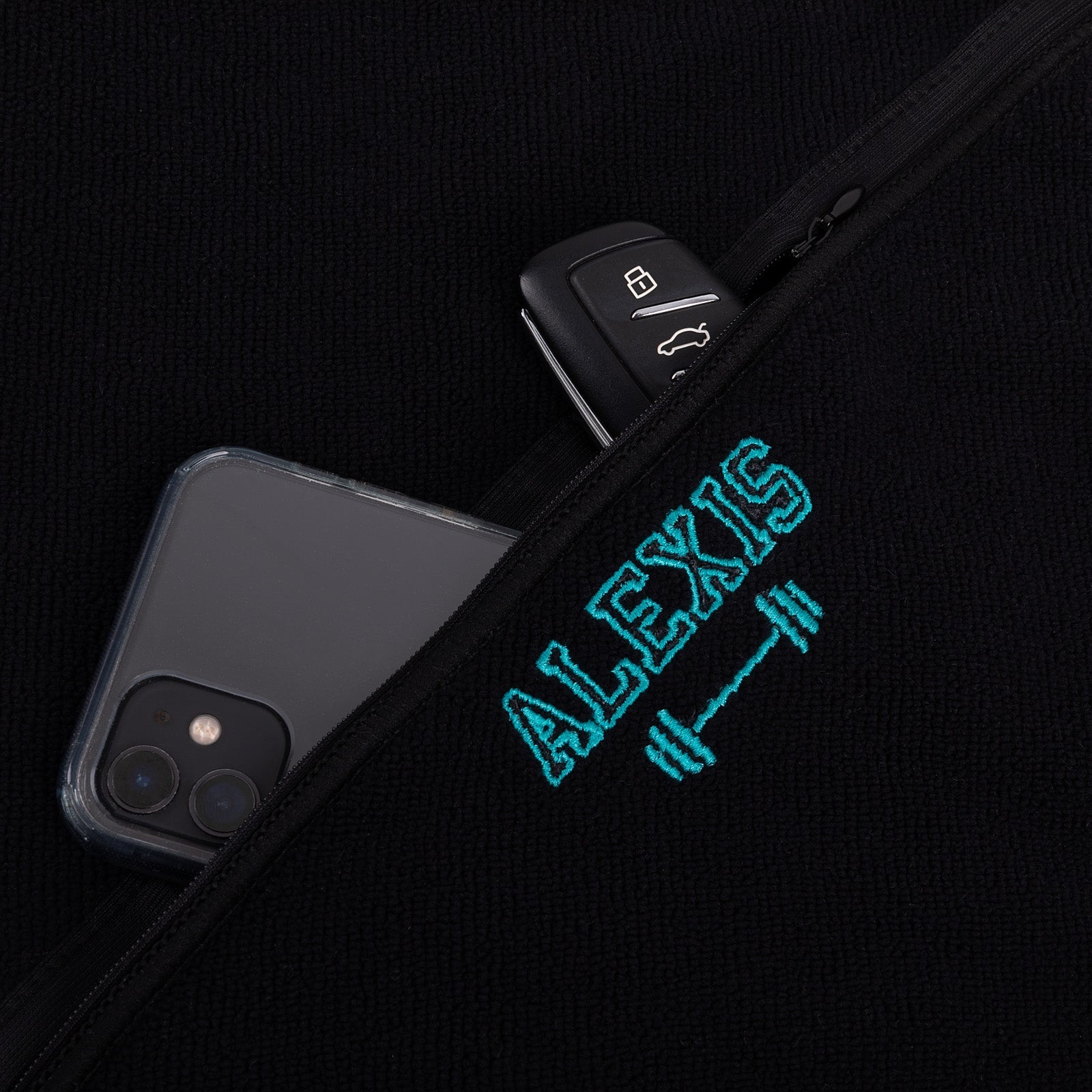 Custom black gym towel with initials and storage pouch