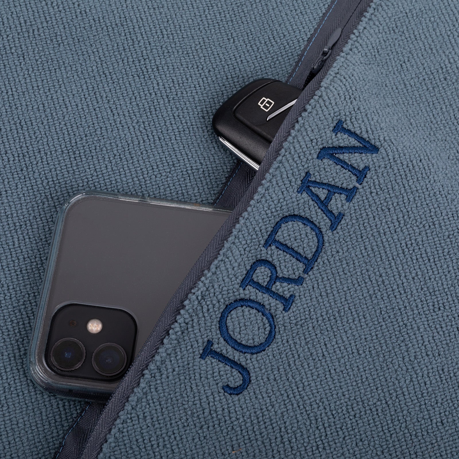 Microfibre workout towel with embroidered name and zip compartment