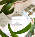handmade tallow soaps made with french green clay and peppermint eucalyptus oil sitting surrounded by gum leaves