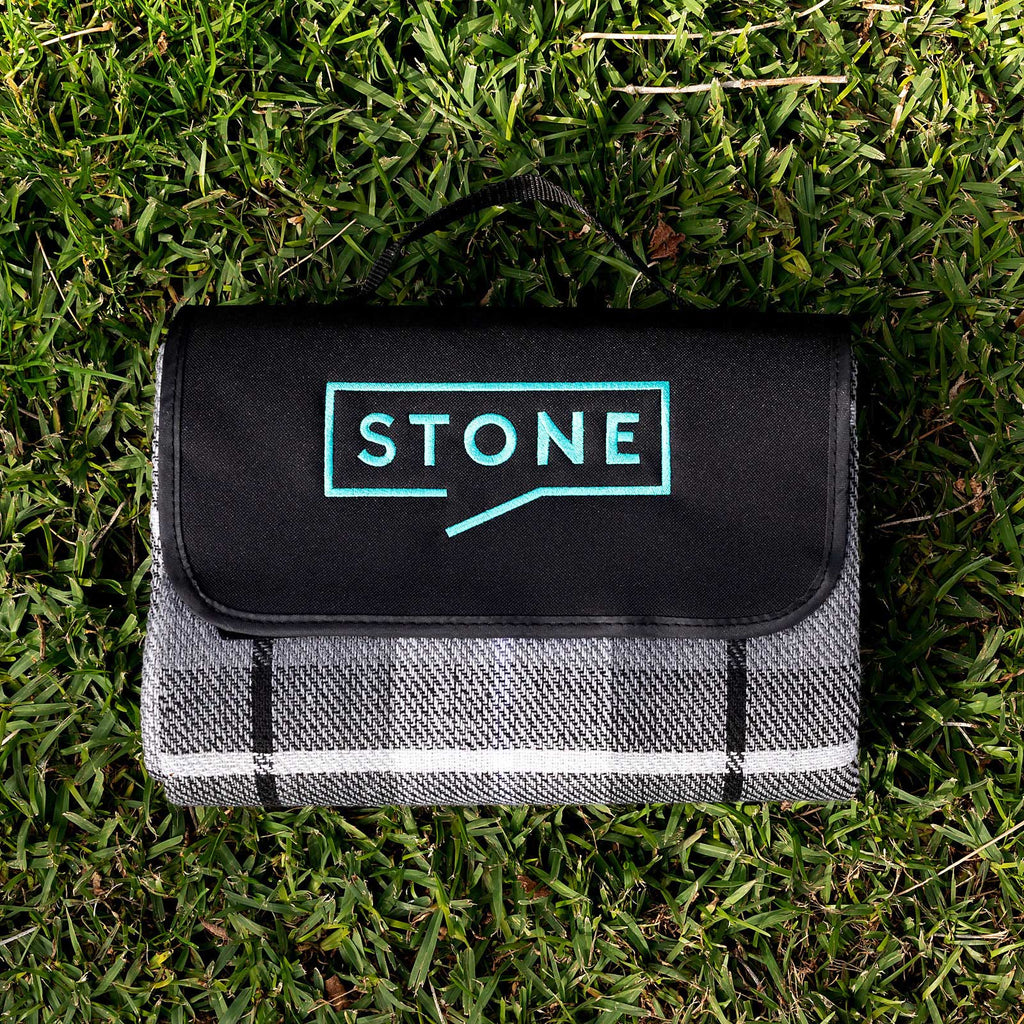 Outdoor picnic setup featuring personalised corporate picnic blanket