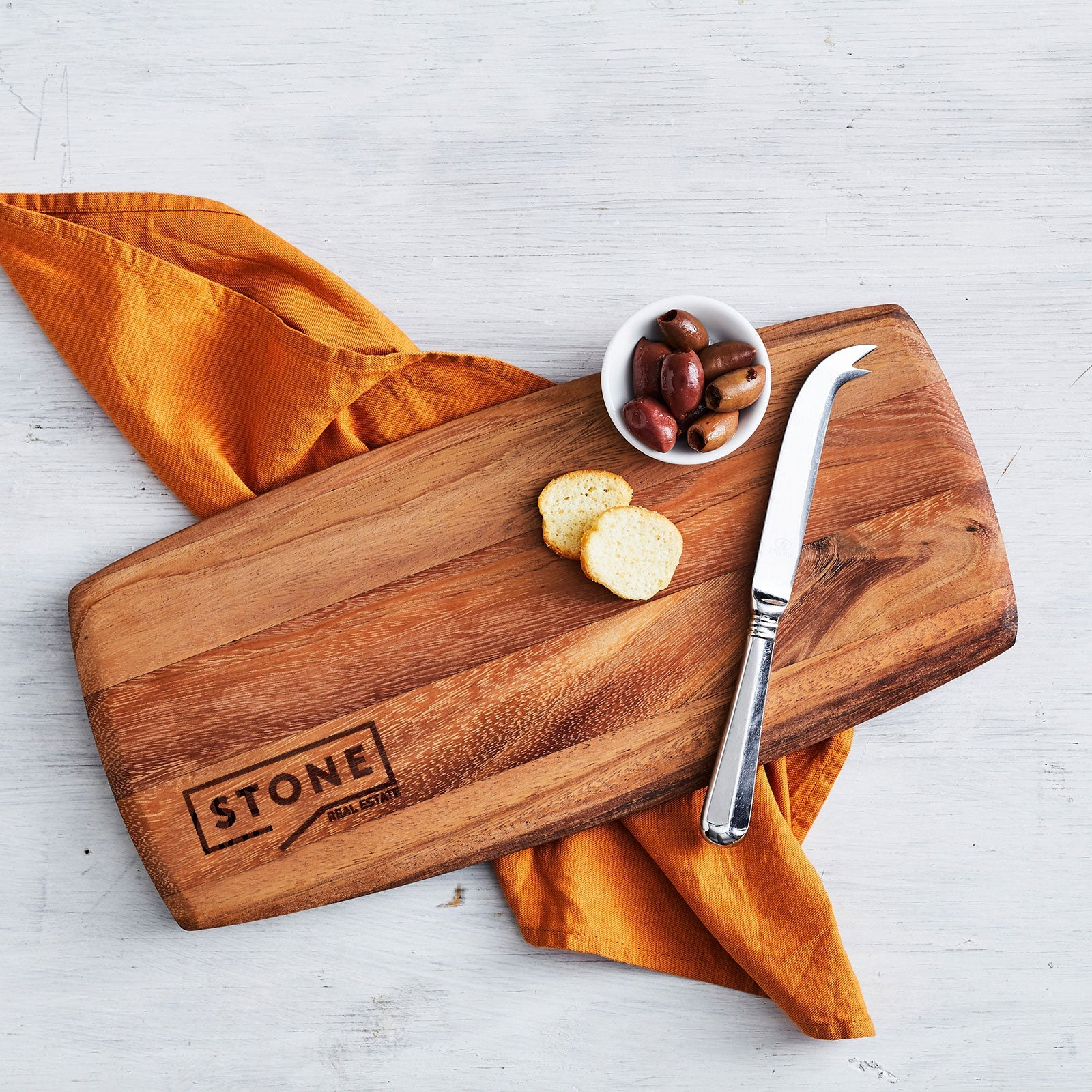 Personalised walnut tapas serving board with engraved company logo for corporate gifting