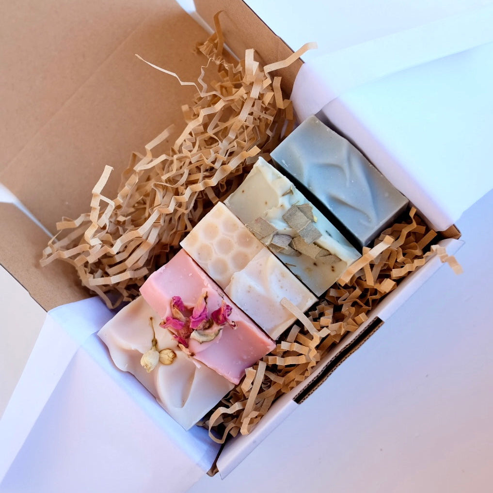 Five tallow soap bars in a box with packaging
